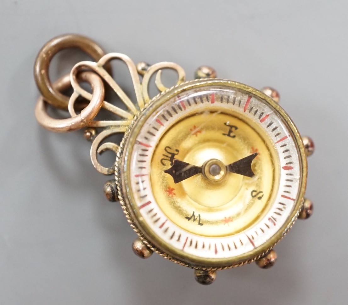 A late Victorian 9ct gold mounted Essex crystal and compass set fob, 25mm, the crystal decorated with the head of a dog.